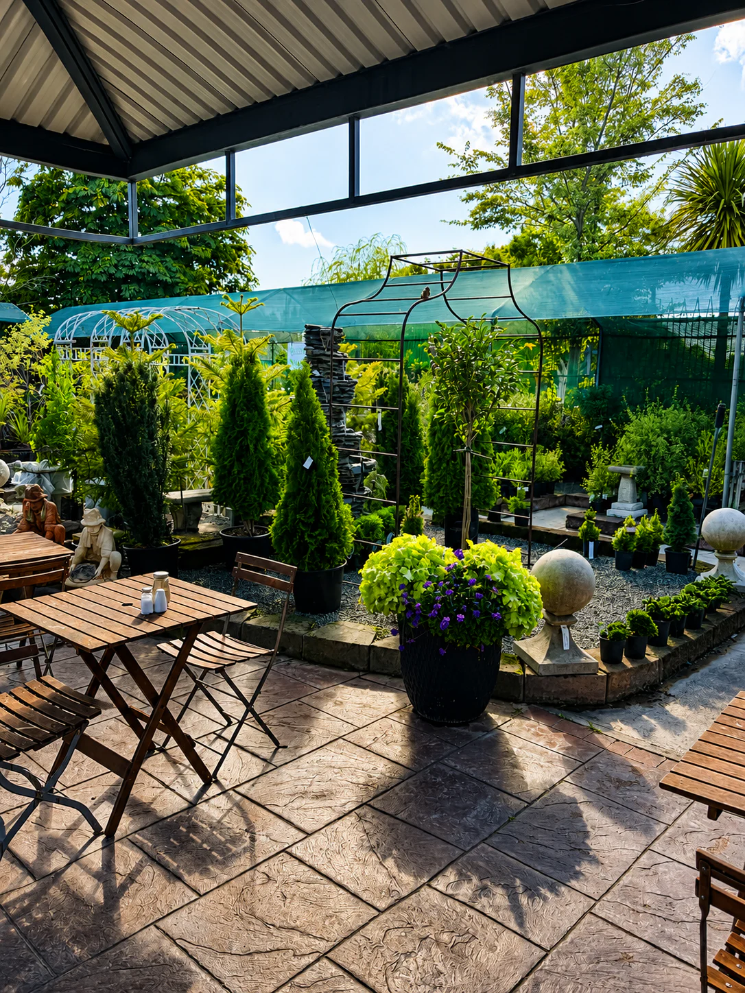 Outdoor tables among the plants at Portstone