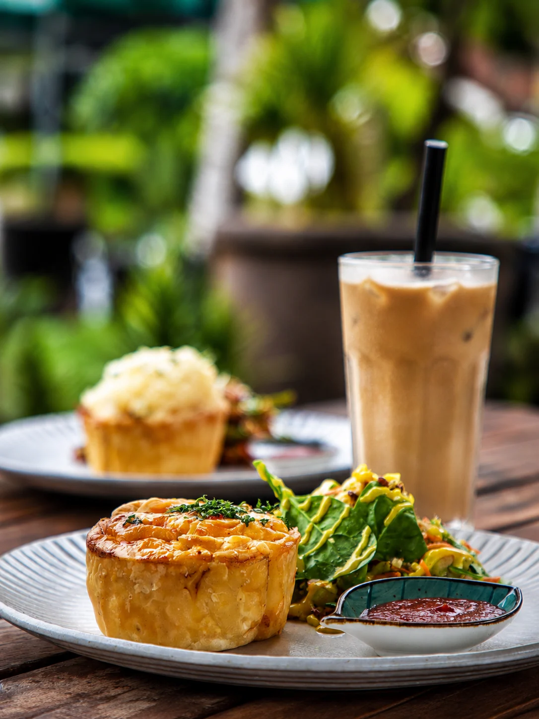 Savoury pastry, salad and iced drink